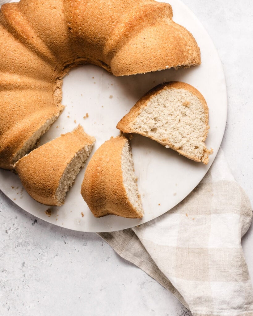 Somali sponge cake with a slice removed, showing soft, fluffy interior.