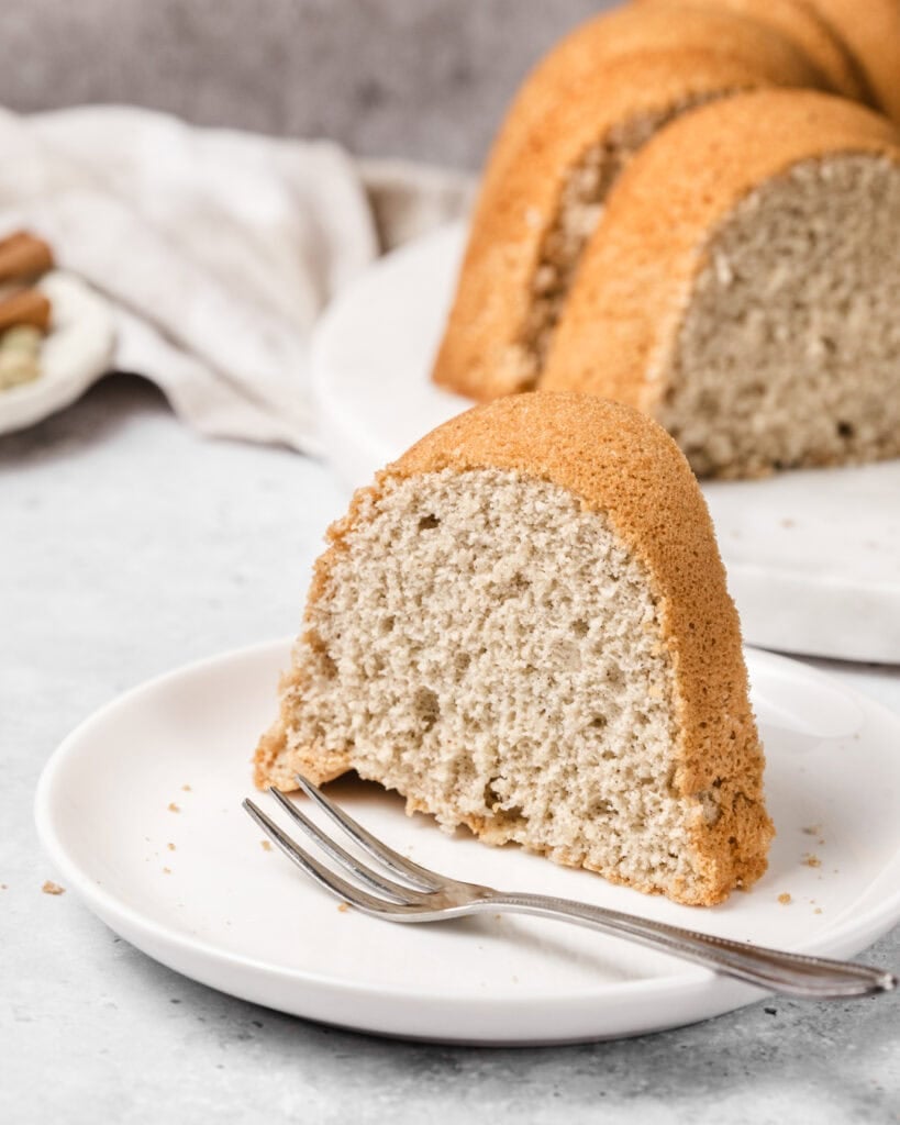Somali sponge cake with cardamom and vanilla flavor, sliced and served on a white plate.