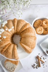 1. Golden-brown bundt cake with a slice cut out, served on a white plate.
