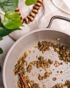 Sautéed spiced ground meat in a frying pan, ready to be served with Somali rice.