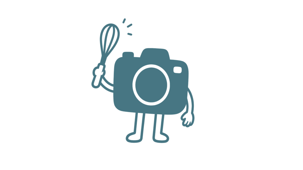 Cartoon camera with arms, legs, and a smiling face, holding a pen.